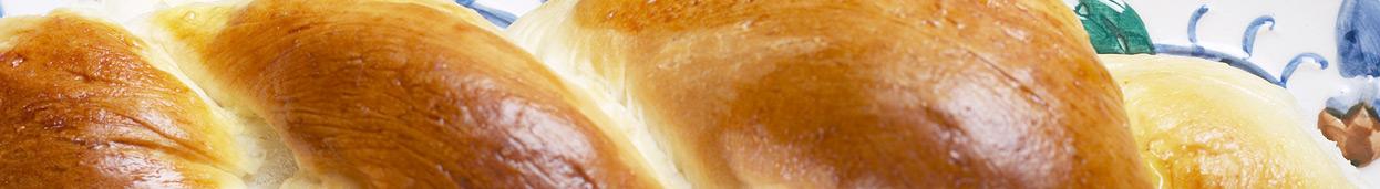 Banner for the jewish holiday of Shabbat featuring a challah, jewish food recipe