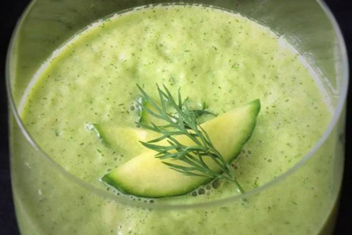 Cold cucumber soup with sliced cucumbers on top