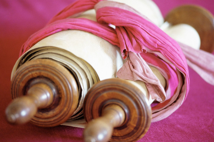 Torah scroll wrapped in pink binding
