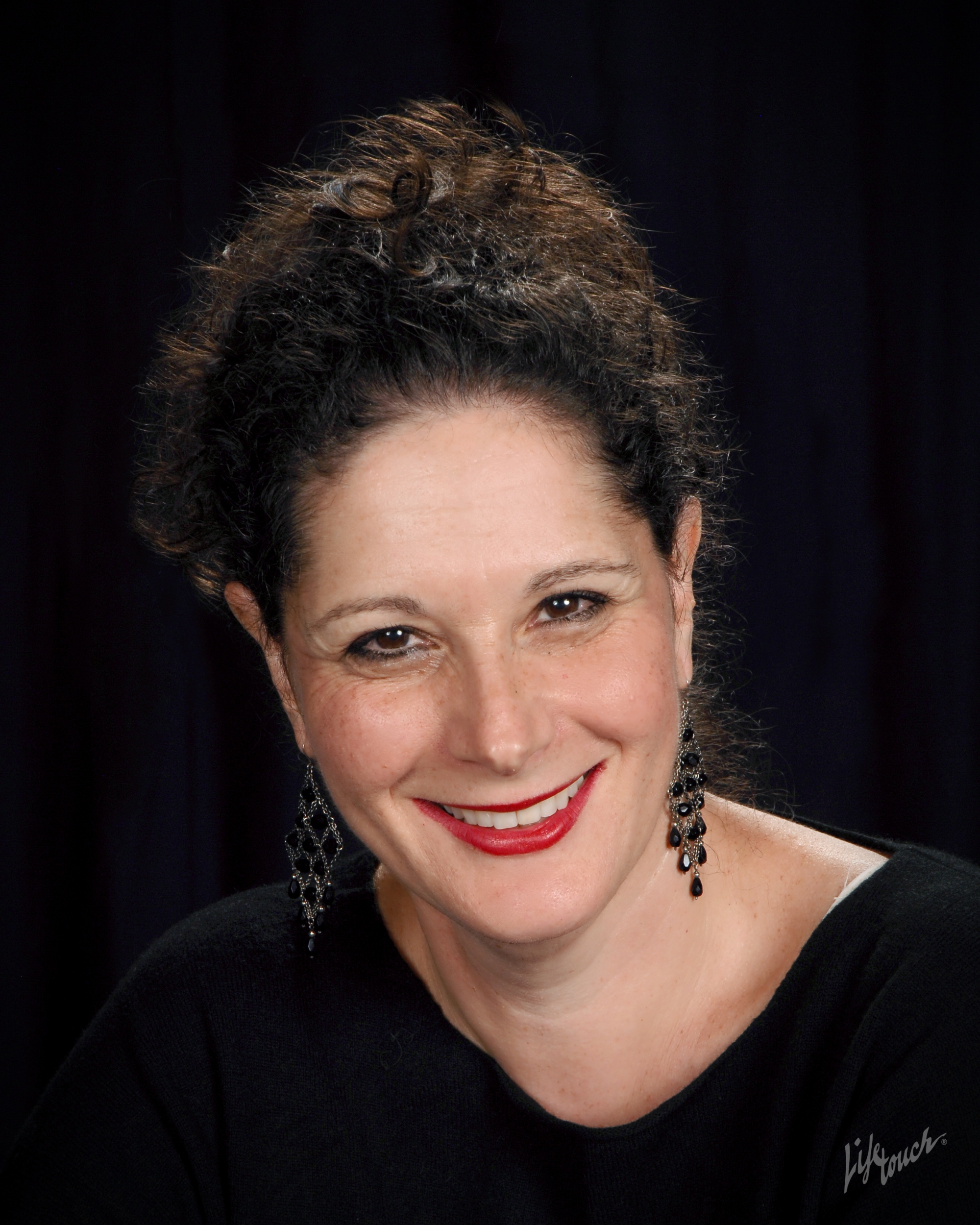 Headshot of Rabbi Linda Joseph set against a black background 