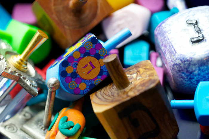 Pile of colorful artistic dreidels