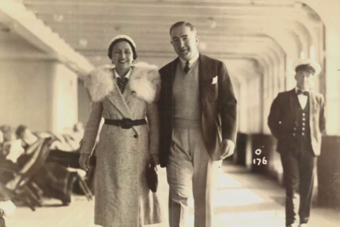 Sepia toned image of a fancily dressed man and woman before the war