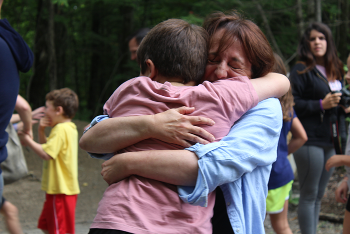 an image of a mother and son hugging