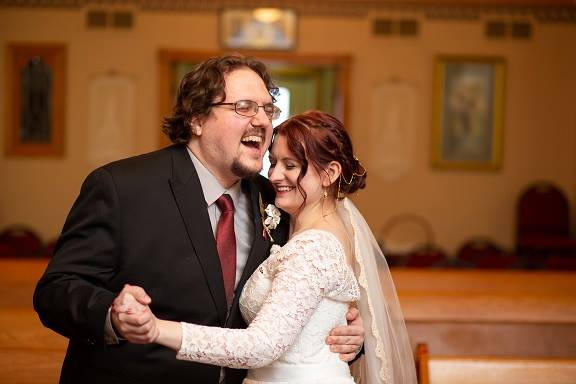 A bride and group laughing