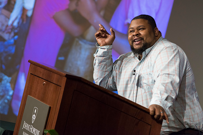Michael Twitty making a speech in front of a podium