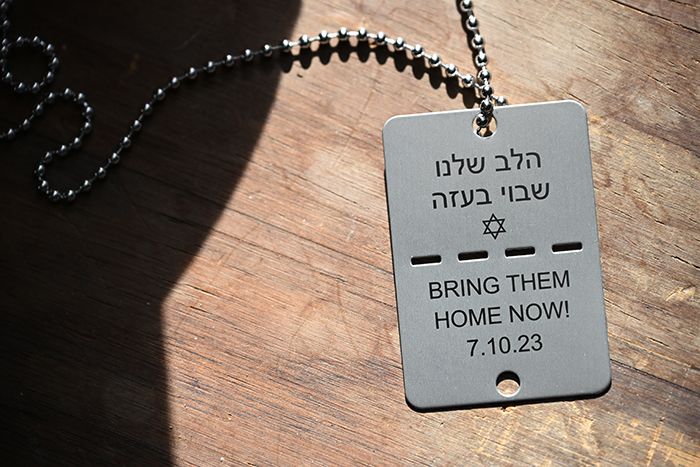 tag with Hebrew and the words Bring them Home Now