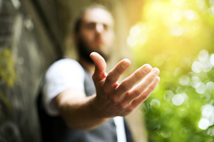 A person reaching out their hand
