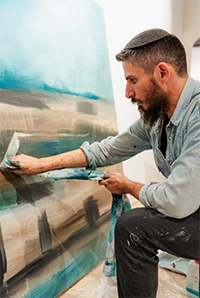 Artist Sam Griffin in his studio after his return from the war in Gaza