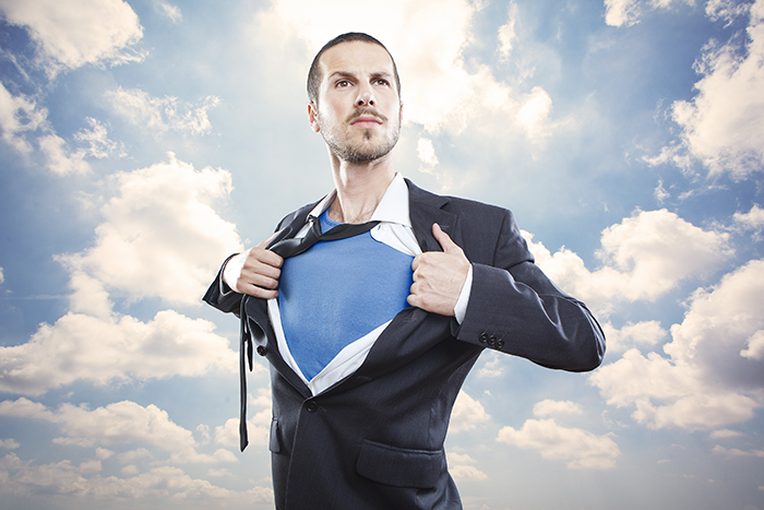 Photo of a man ripping his shirt off like Superman