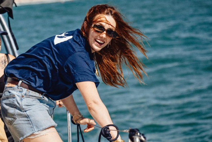 Photo of Ofri Etta Reiner, a young woman who survived the Nova music festival massacre, on a boat