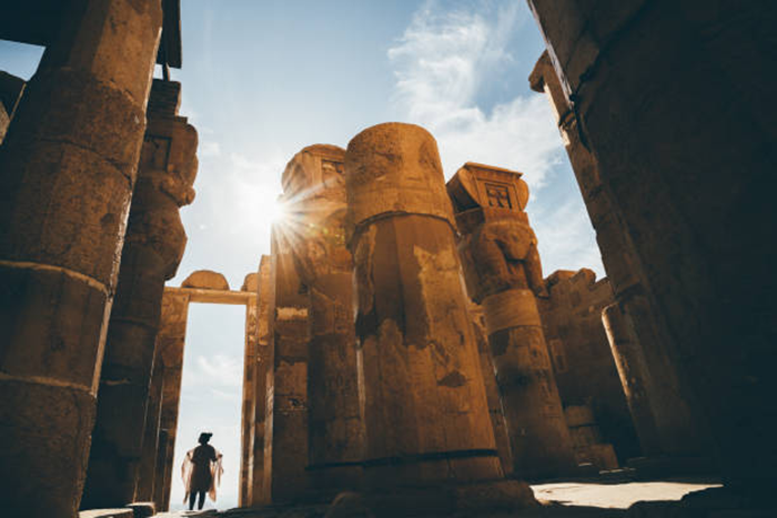 Photo of a woman visiting the Temple of Hatshepsut in Luxor, Egypt.