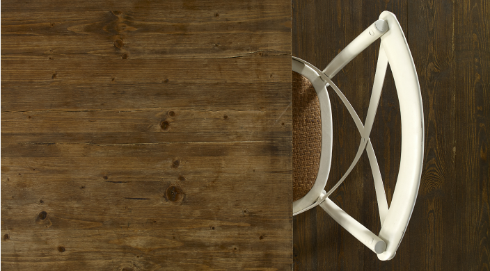 Aerial view of an empty chair at a wooden table