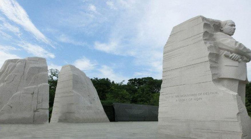 Statue of MLK against a blue sky