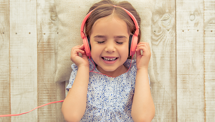 Young child listening to music