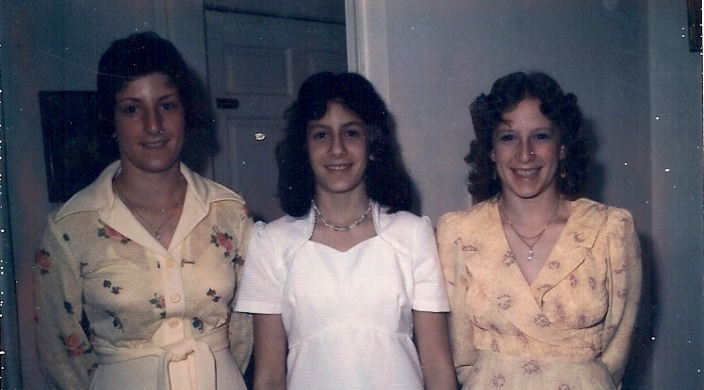 The author, center, with her older sisters on the day she became a bat mitzvah