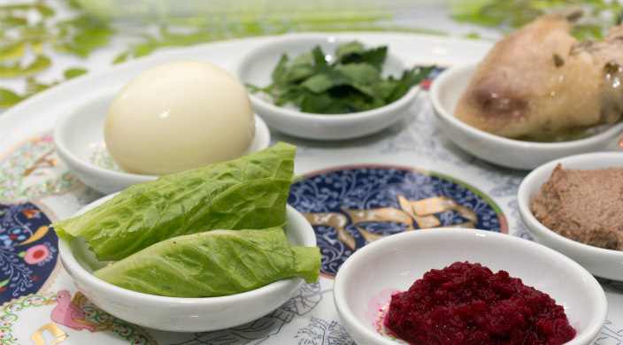 Close up image of a colorful seder plate with ritual elements upon it 