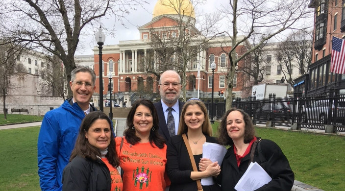 Group of rabbis standing in front of the Massachusetts statehouse 