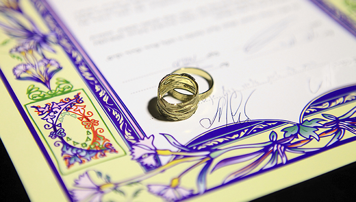Ketubah with gold rings and purple border