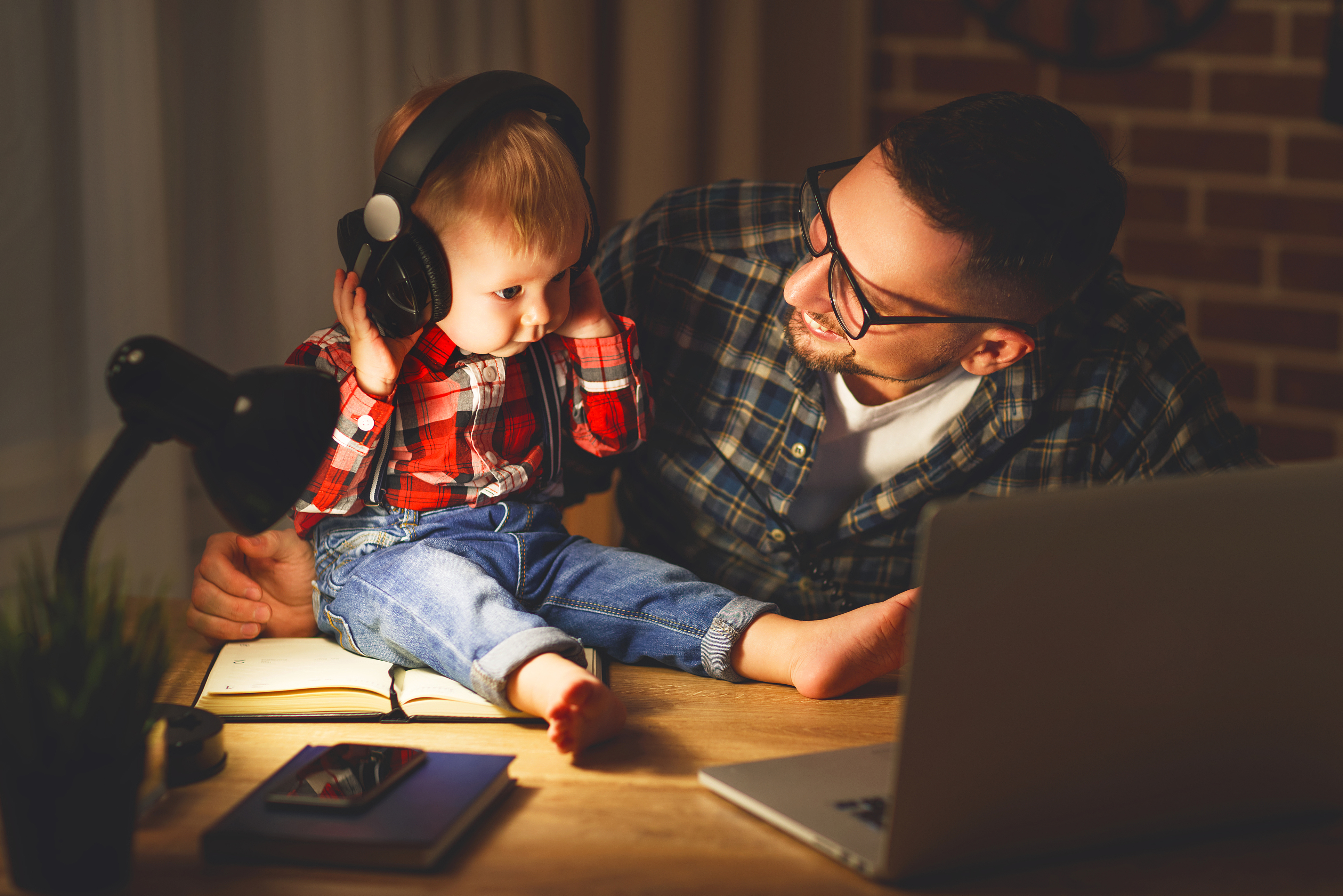boy and father listening to music