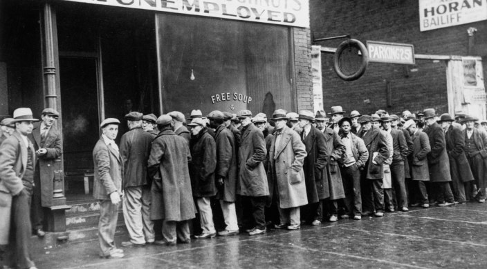 Unemployed men queued outside a Depression era soup kitchen opened in Chicago by mobster Al Capone in 1931