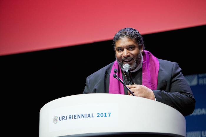 Reverend Barber speaks at a podium