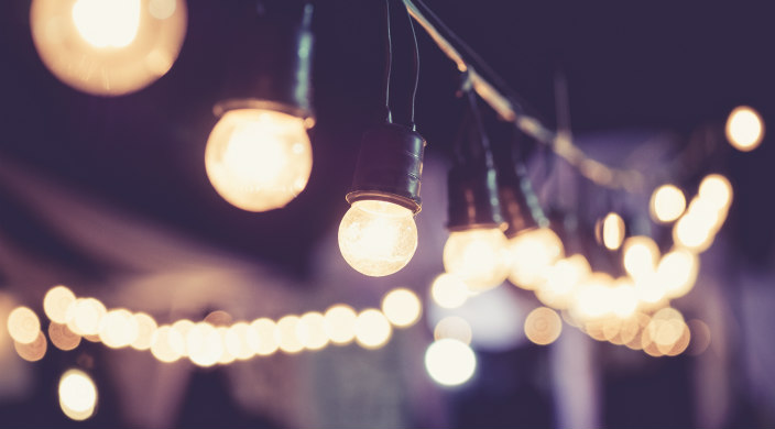 String of different types of lights outdoors in the dark