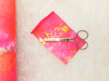 Scissors and a sheet of paper for a Passover Activity