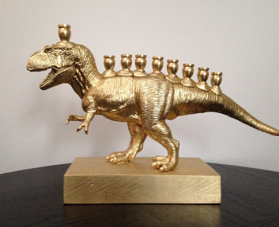 Golden menorah in the shape of a tyrannosaurus rex