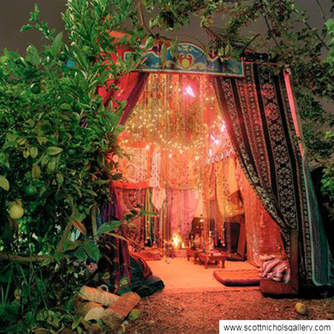 Large orrnate sukkah with tapestries and lights
