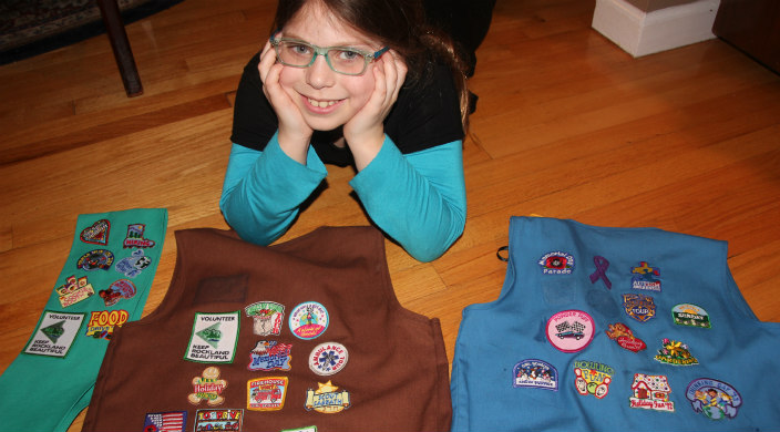 Girl Scout with her badges