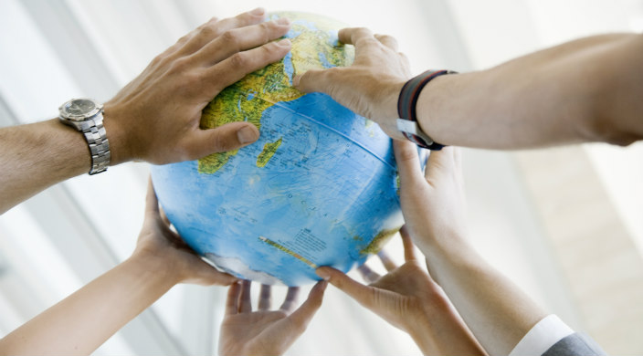 Globe supported by hands