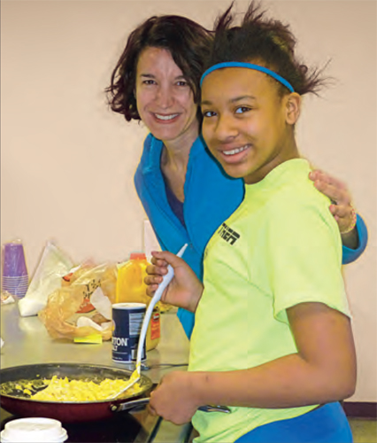 Geniya, 12, joins me in making breakfast at Congregation Shaare Emeth, St. Louis. 