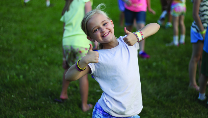 girl holding a thumbs up