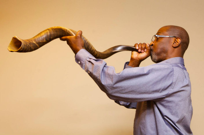 Man blowing a shofar