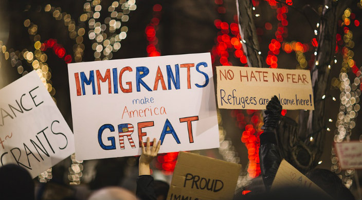 Protest signs welcoming immigrants