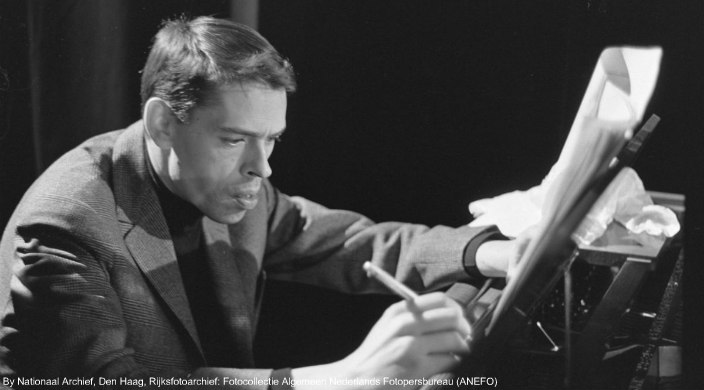 Singer-songwriter Jacques Brel composing at the piano