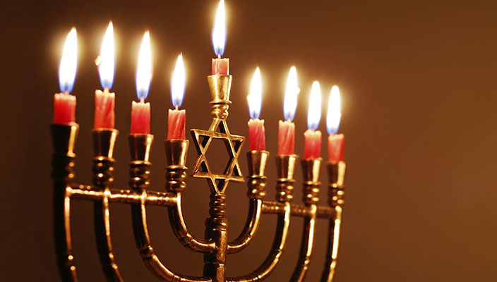 A menorah with all candles lit