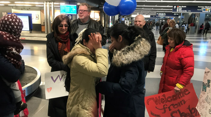 Two Syrian refugee sisters reuniting at the airport in Chicago