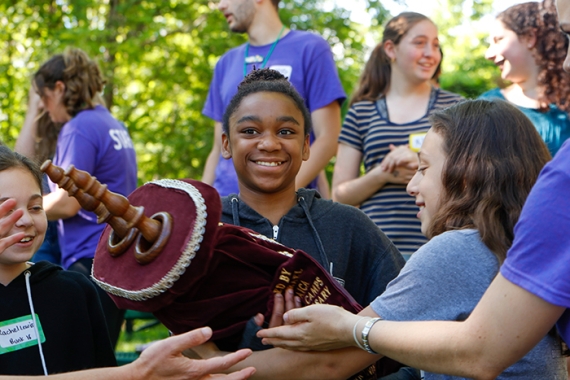 Children holding the Torah at URJ Eisner Camp