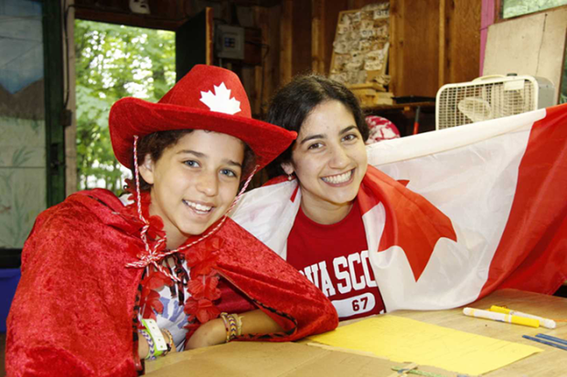 Photo of two people at Camp George on Canada Day