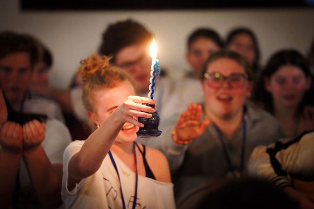 Photo of a girl holding a havdallah candle
