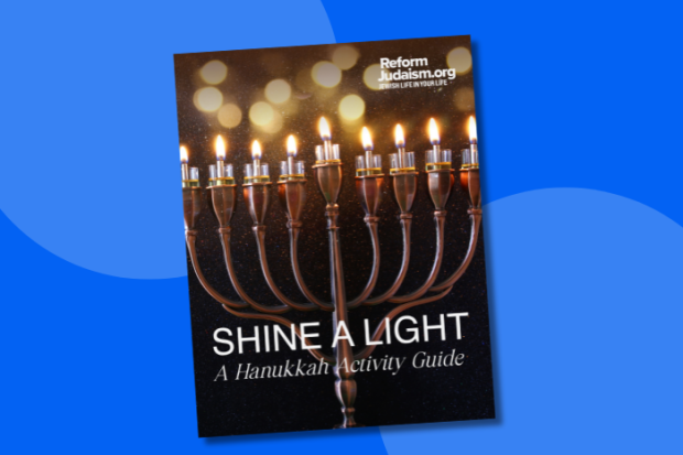 Photo of the cover of the 2025 Hanukkah Activity Guide over a blue background