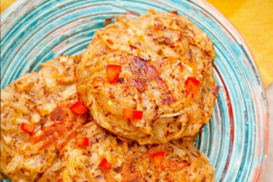 Vegan baked potato latkes on a light blue plate