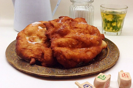 Large mound of fried dough on a platter