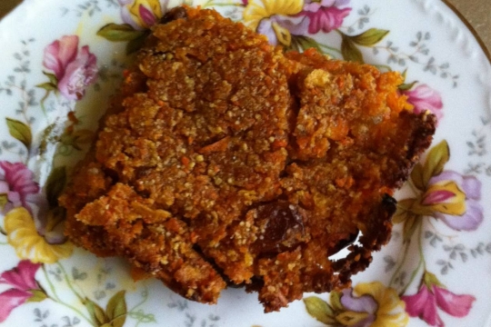 Slice of vegan sweet potato kugel on a floral plate 