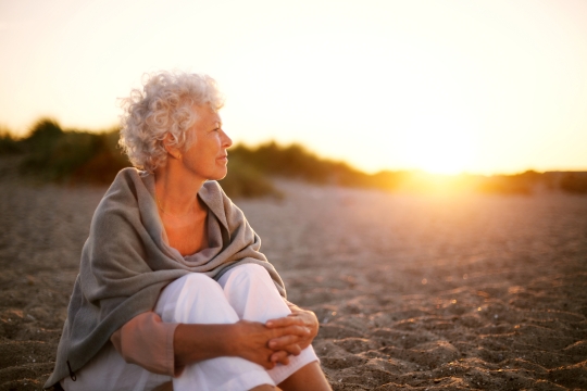 woman sitting on beach