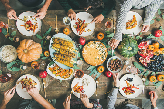 Photo of a table full of different vegetable dishes