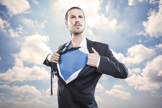 Photo of a man ripping his shirt off like Superman
