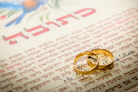 Ketubah, or wedding contract, with wedding bands