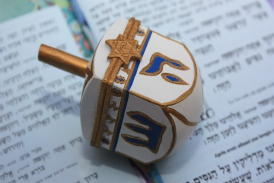 Ornately painted wooden dreidel